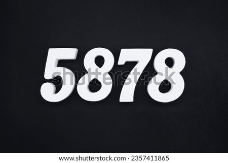Black for the background. The number 5878 is made of white painted wood.