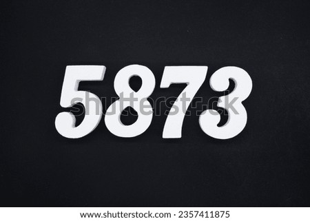 Black for the background. The number 5873 is made of white painted wood.