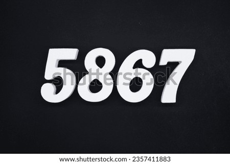 Black for the background. The number 5867 is made of white painted wood.