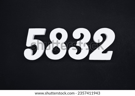 Black for the background. The number 5832 is made of white painted wood.