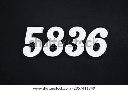 Black for the background. The number 5836 is made of white painted wood.