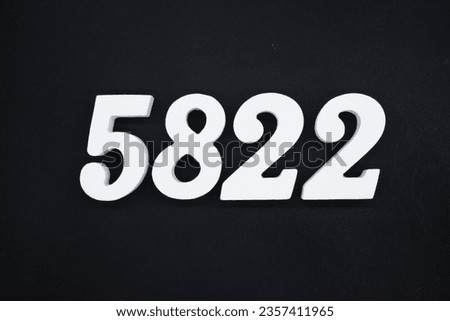 Black for the background. The number 5822 is made of white painted wood.