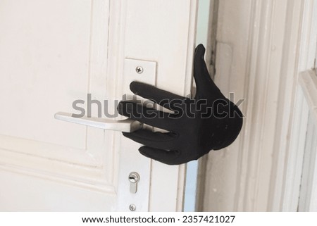 breaking and entering into an apartment, burglary and stealing as a criminal offense Royalty-Free Stock Photo #2357421027