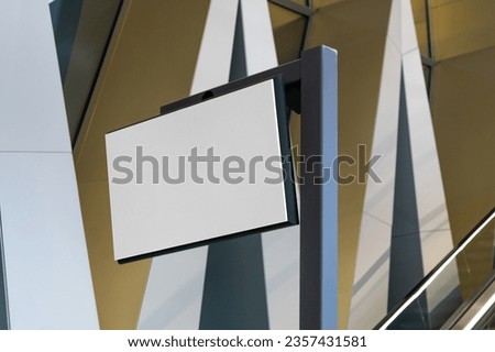 Blank signboard navigation mockup in the urban environment, empty space to display your advertising or branding campaign
