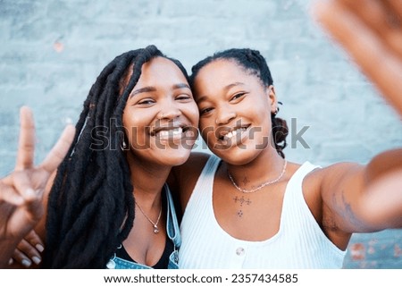 Smile, friends and selfie with black woman against wall with phone for social media, happy and peace sign. Digital, internet and portrait of girl in urban city for freedom, support or mobile together