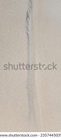 Lineart on top of the sand Royalty-Free Stock Photo #2357445039