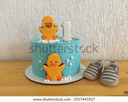 Cake for a child's birthday. Cute cake with a little duckling. Cake with a cute duckling. Cake for the first birthday