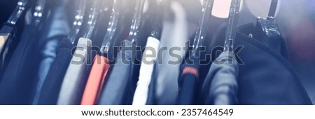 Clothes hangers are sold in luxury department stores. Selective focus