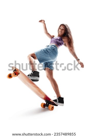 Female skater rides on skateboard. Female skateboarding. Sport. Girl on a longboard. Action. Sport emotion Royalty-Free Stock Photo #2357489855