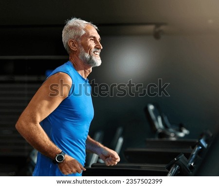 Portrait of a senior man exercising in a gym, mature male running using treadmill machine equipment, healthy lifestyle and cardio exercise at fitness club concepts, vitality and active training coach  Royalty-Free Stock Photo #2357502399
