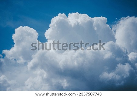 blue sky with massive clouds