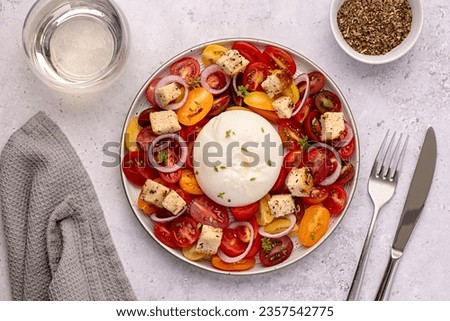 Food photography of salad, baked tomato; cheese; mozzarella; white wine, garlic; crouton; thyme; toast; vegetable
