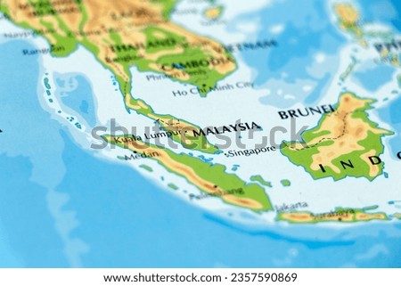 world map or atlas of asia continent and indonesia, malaysia, singapore in close up Royalty-Free Stock Photo #2357590869