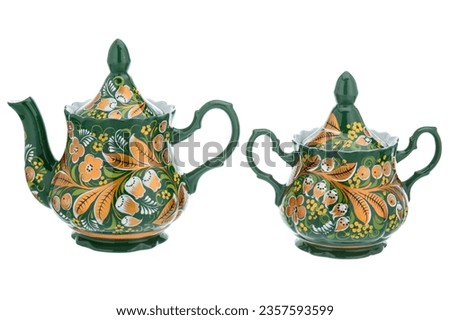 Tea Set Green Gold of Old Traditional Russian folk utensils. Dishes teapot and sugar bowl with handmade painting floral ornament in style isolated on white background.