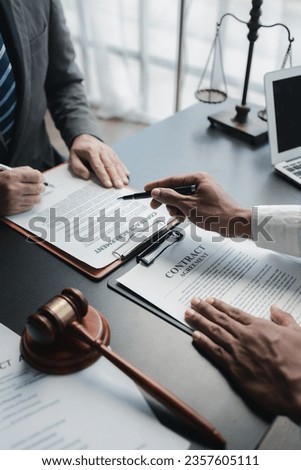 Lawyers give advice to clients and draft contracts. Lawyers seek legal information to plan for representing clients in cases and draft case employment contracts, using the law. Lawyer concept. Royalty-Free Stock Photo #2357605111