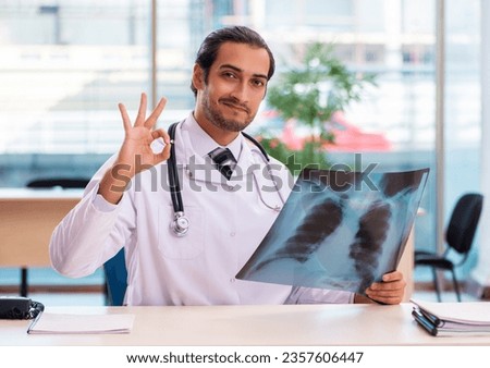 Young male doctor radiologist working in the clinic Royalty-Free Stock Photo #2357606447