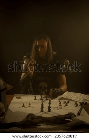 Young adult playing role playing game as warrior.