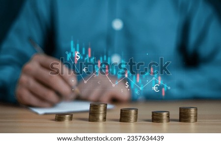 Saving money concept. Hand putting money coin stack with growing business graph. Panoramic business banner with copy space.

