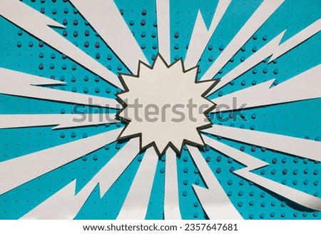 Handmade blue paper cut out dot background with speech bubble. Pop art and comic concept. Blue color.