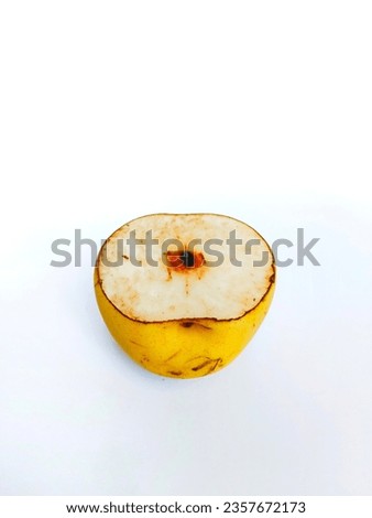Close-up photo of a pear that has been cut on a white background