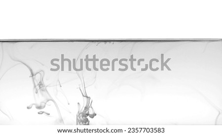 Black color or ink is smoke on white background,Abstract smoke pattern,Colored liquid dye,Splash paint