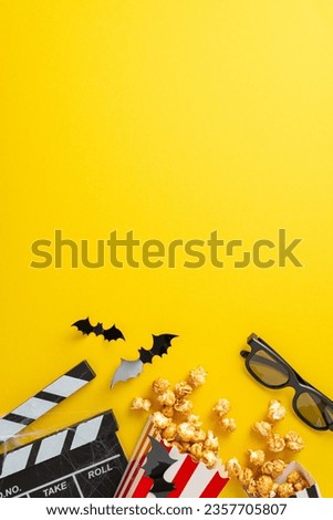 Friends indulge in Halloween-themed cinematic gathering, captured from vertical top view. Popcorn boxes, creepy decorations set the tone for chilling movie night on yellow background with empty space