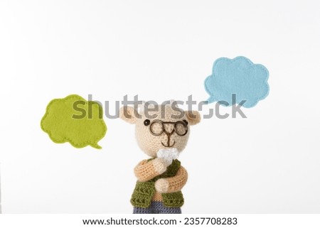 Handmade knitted toy. cute and small animal Amigurumi .speech bubble