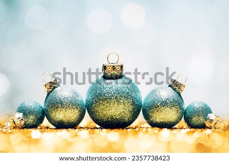 Glittery Christmas - Lights Bokeh Defocused Decoration Gold turquoise Royalty-Free Stock Photo #2357738423