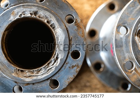 Severe corrosion of pipe flanges in the petroleum industry. Royalty-Free Stock Photo #2357745177
