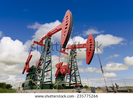 oil pump jacks on a oil field 