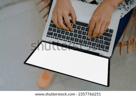 A person working on a laptop in concept business work top view of blank white screen laptop computer 