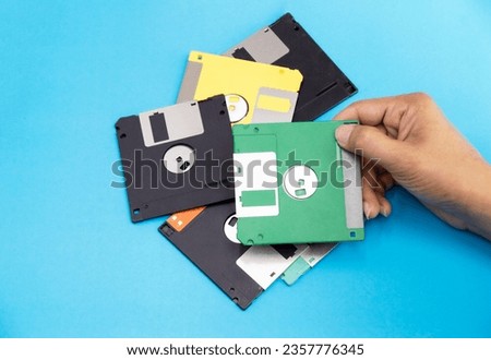 Floppy disks were popular around the world in the 90s. The early days of recording technology Royalty-Free Stock Photo #2357776345