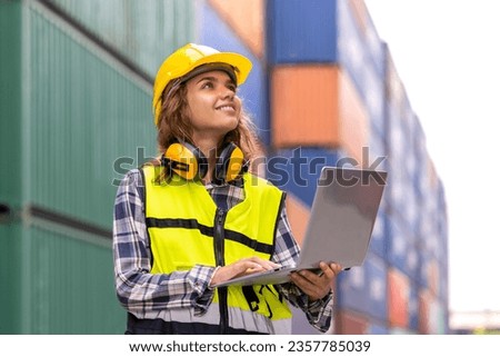 Portrait of caucasian female engineer in container yard, International import export and logistic business concept. Logistics, transportation, distribution concept. Factory, warehouse, worker. Royalty-Free Stock Photo #2357785039