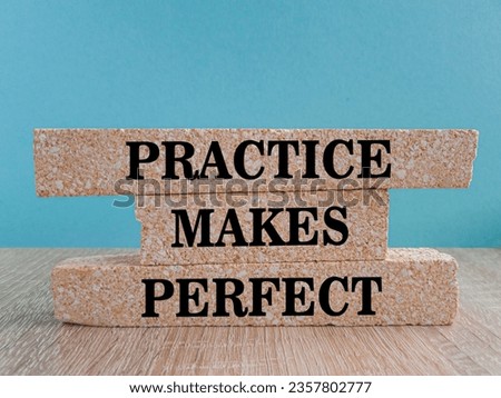 Practice makes perfect symbol. Concept words Practice makes perfect on brick blocks. Beautiful wooden table blue background. Business practice makes perfect concept. Copy space.
