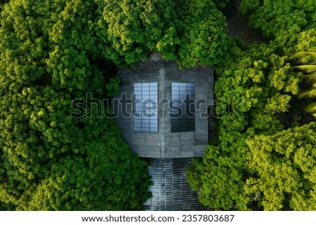 Solar panel on house roof surrendering with beautiful green tree, sustainability and clean energy resource concept. Royalty-Free Stock Photo #2357803687