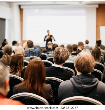 Speaker giving a talk in conference hall at business event. Rear view of unrecognizable people in audience at the conference hall. Business and entrepreneurship concept Royalty-Free Stock Photo #2357810267