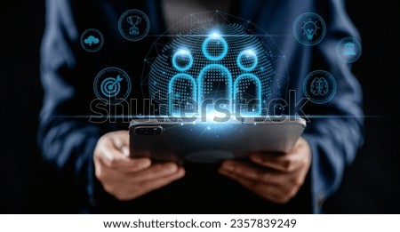 Businesswomen using a digital tablet analyze visual network global structure Human Resources, management and recruitment. employment headhunting, finding and training team leadership. 
