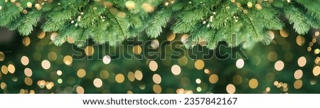 Merry christmas and new year holidays background. Blurred bokeh background with light bulbs and Christmas tree branches. Banner. Royalty-Free Stock Photo #2357842167
