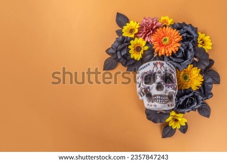 Dia de los muertos Feast flat lay, holiday background with fall black, orange, yellow flowers, lightbox with text Dia de los muertos (Mexican Day of the Dead on mexican) and traditional decor