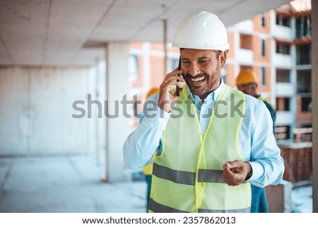 Man architect at building site. Confident construction manager in formal clothing wearing white hardhat. Successful civil engineer at construction site with copy space. Technology makes my job easier Royalty-Free Stock Photo #2357862013