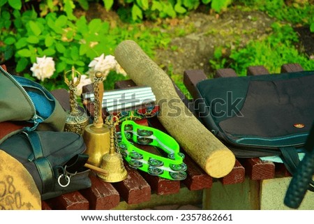 Street musician's instruments. a singer who plays musical instruments: Triangle, Bell, accordion, clarinet, trumpet, trombone, guitar and washboard.Russian folk instruments.Jazz band.Close-up.