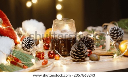 A table with Christmas decorations and sweets, I take hot chocolate with marshmallows