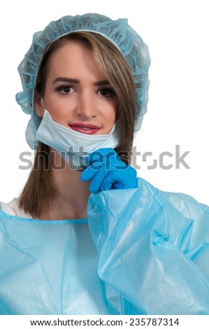 Beautiful young woman surgeon getting ready to perform a surgery