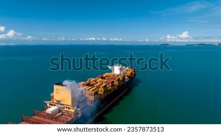 cargo container ship sailing in green sea to import export goods and distributing products to dealer and consumers worldwide, by container ship Transport, business logistic delivery service, aerial 