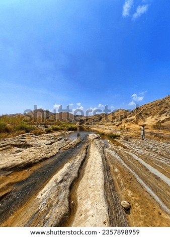 The beautiful picture shows the Lines which created by flow of water when water level rises it flows from these lines which are dry now. This natural stream found in Wahi Pandhi dadu sindh