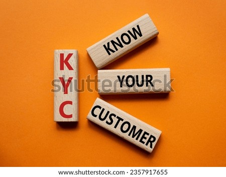 KYC - Know Your Customer. Wooden cubes with word KYC. Beautiful red background. Business and Know Your Customer concept. Copy space
