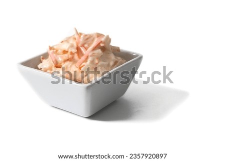 A bowl with American salad isolated on white background. A delicious American salad made with carrots and cabbage, perfectly dressed and full of flavor. Royalty-Free Stock Photo #2357920897