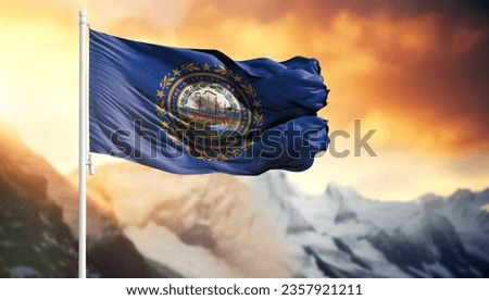 Flag of State of New Hampshire on a flagpole against a colorful sky