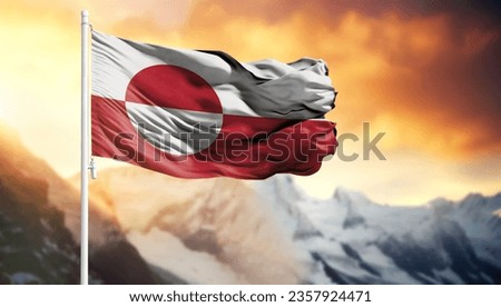 Flag of Greenland on a flagpole against a colorful sky