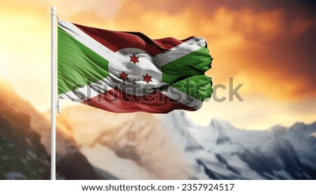 Flag of Burundi on a flagpole against a colorful sky